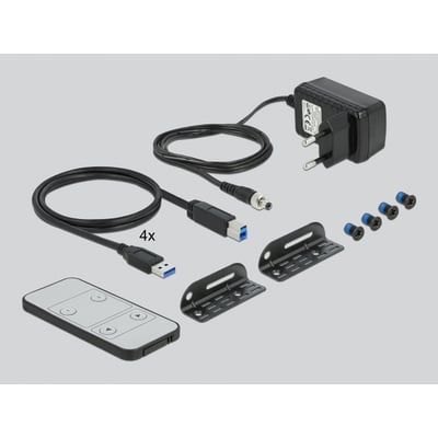 Medfølgende tilbehør til Delock KVM switch, inkluderer strømforsyning, USB 3.0 kabler, fjernbetjening og monteringsbeslag.