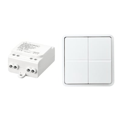 Jumitech BasicDim Wireless DALI modtager og et hvidt 4-tryks trådløst tryk, vist på hvid baggrund.