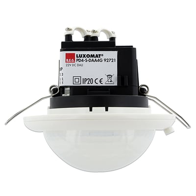 B.E.G. Luxomat PD4-S-DALI-i tilstedeværelsessensor til indbygning, vist med monteringsklips og DALI-mærkning.