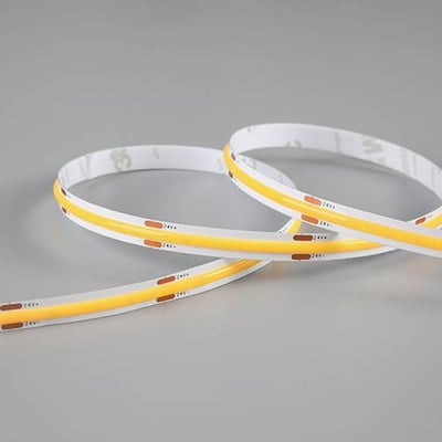 Ansell Lighting C-Cell COB LED bånd, 50 meter i 4000K neutralhvid med 24V spænding og 8W pr. meter, vist på grå baggrund.