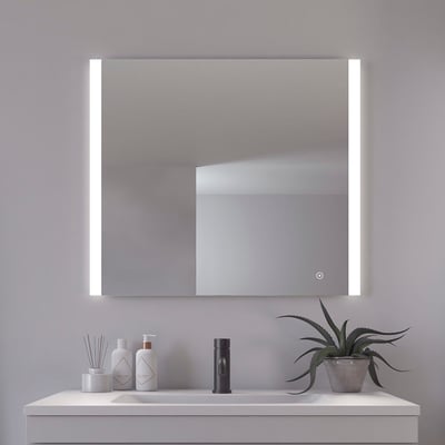 Frontvisning af Loevschall Vega spejl 80x70 cm, med integrerede lysfelter på siderne og en enkelt knap til lysstyring.