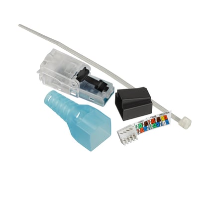 Nærbillede af Schneider Electric Actassi RJ45 Cat.6A UTP plug monteringskomponenter, med fokus på ledningsfarvekoder og stikdetaljer.