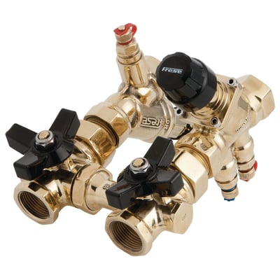 Frese Modula ventilsystem i messing med sorte og røde ventiler og et sort justeringshoved med Frese logo.