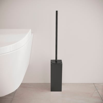 Cosmic Metric toiletbørste i mat sort med en firkantet holder, der står ved siden af en hvid toiletkumme.
