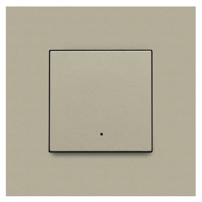 Niko Home Control 1-tryk i champagnefarve med sort kant, viser den integrerede LED-indikator i midten af knappen.