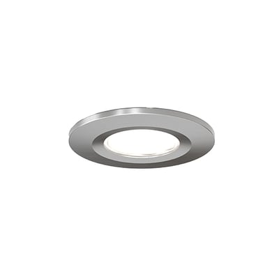 Ansell Lighting Prism Pro XM-frontdel i satin krom, vist skråt med en rund ring og åbning i midten.
