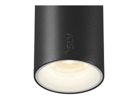 Tæt på SLV NUMINOS XS spot i sort, viser armaturets cylinderform og det integrerede lys med varmt skær.