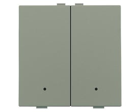 Detalje af et bronze Niko Home Control 2-tryk, der fremhæver dets teksturerede overflade og diskrete LED-indikator.