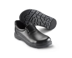 Sika Footwear Optimax S2 sikkerhedssko i sort læder, str. 41, vist med sålen opad, der viser skridsikre mønstre.