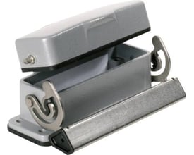 Weidmüller HDC chassishus i størrelse 5, grå aluminium med åbent låg og synlige låsearme på hvid baggrund.