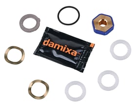 Komplet Damixa pakningssæt til S26/S29 tude med foliepakke og forskellige metal- og plastkomponenter på hvid baggrund.