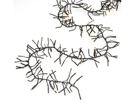 Konstsmide lyskæde cluster med 960 varm hvide LED'er på en snoet sort ledning, vist mod en neutral hvid baggrund.