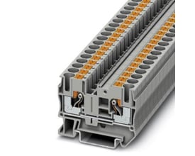 Nærbillede af Phoenix Contact grå gennemgangsklemme, der viser den interne push-in-mekanisme og detaljer om 6mm² tilslutning på en monteringsskinne.