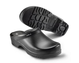 Sika Flexika tøffeltræsko i sort Permair læder set fra siden med sålen vendt opad, der viser olieresistente mønstre.