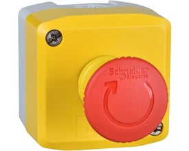 Schneider Electric nødstopbox med gult låg, rød svampeknap og drej-for-frigivelse mekanisme på hvid baggrund.