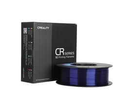 Creality CR-PETG-filament på spole i blå, gennemskinnelig farve ved siden af den sorte emballage.