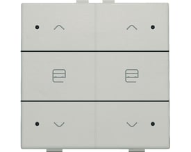 Niko motortryk med dobbelt funktion i lysegrå, med op- og ned-pile samt gardin-symboler og små LED-indikatorer.