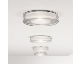 Astro Vancouver Round indbygningsspot i krom og glas, vist med en række af spots monteret i et loft.