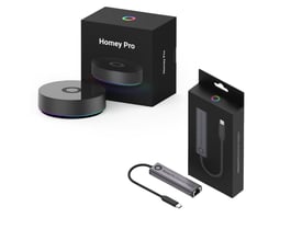 Athom Homey Pro (2023) smart home hub og Homey Pro Ethernet adapter bundle i æske på hvid baggrund.