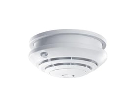 Esylux Protector K røgalarm til 230V med 9V backup, hvid rund model med ventilationsslidser og testknap, monteret på hvid baggrund.