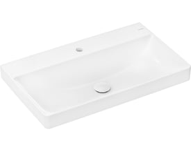 Hansgrohe Xelu Q håndvask i hvid porcelæn set skråt fra siden, med tydeligt hanehul og blank krom bundventil.