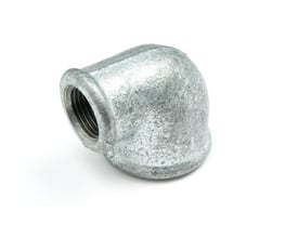 Unico vinkel 90 grader, reduceret type med 3/4" og 1/2" muffe gevind i galvaniseret metal.