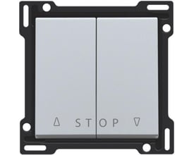 Niko tangent til jalousiafbryder i sterling med symboler for op, ned og stop monteret i sort ramme.