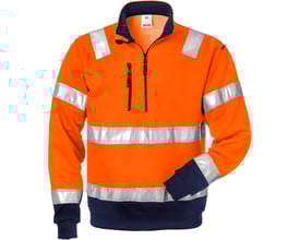 Kansas sweatshirt i orange og marineblå med reflekterende bånd, lynlås, telefonlomme og ribkant. Godkendt EN471.
