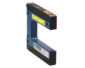 Schneider Electric foto laser gaffel med 95x15mm åbning, blå metalhus med sorte plastkomponenter og advarselsmærkater.
