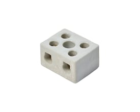 Porcelænskronemuffe med 16 mm2 kapacitet og 2 poler med et centralt hul til ledningsforbindelse.