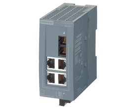 Siemens Scalance XB004-1LD unmanaged IE switch med 4 RJ45 porte og 1 SC LWL-port i grå plast, præsenteret på en neutral baggrund.