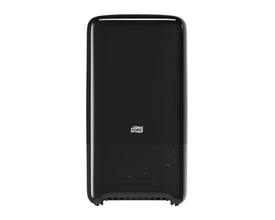 Tork Twin Mid-size toiletpapir dispenser i sort plast med logo, vist uden papir.