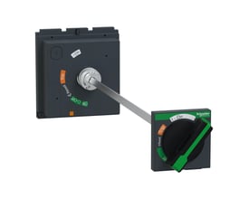 Nærbillede af Schneider Electric drejegreb og dørk, viser den sorte betjeningsknap og grønne Schneider Electric logo.