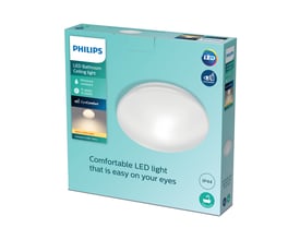 Philips Canopus loftlampe i hvid emballage med LED-logo, IP44-klassificering og EyeComfort-mærke vist på en lys blå baggrund.