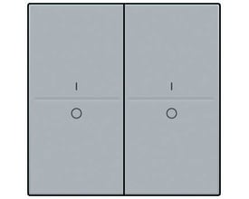 Niko tangent med I/O symbol til trådløs 4-tryk i sterling grå, der viser to trykflader med et 'I' og et 'O' symbol.