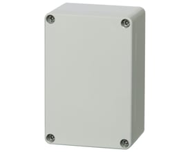 Set fra siden: Fibox Euronorm II monteringskasse i lysegrå polycarbonat viser sideprofil og skruedækslerne.