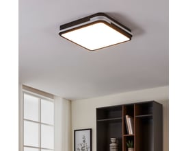EGLO Genovese-Z loftlampe i sort og hvid, monteret i et moderne rum med bogreol og vindue.