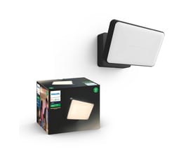 Sort Philips Hue Welcome White udendørs LED-projektør med rektangulært lysfelt og produktæsken ved siden af.