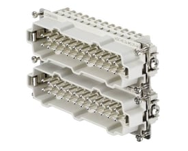 Weidmüller HDC Han-Indsats med 24 poler og jord, med skruetilslutning, set fra siden med fokus på de mange stikpinde.