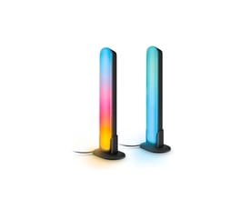 To WiZ Gradient Light Bars i sort med RGBIC-lys i forskellige farver, står oprejst på hvid baggrund.