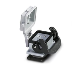 Phoenix Contact HEAVYCON indbygningshus B06 i havvandsbestandigt aluminium med gråt plastdæksel, åbent og synlig ledende profiltætning.