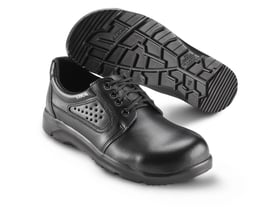 Sika Footwear Optimax snøresko i sort størrelse 37, vist med undersiden opad for at vise den skridhæmmende SRA ydersål med tydeligt mønster.