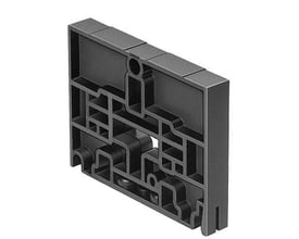 Festo separator plate CPV14-DZP i sort plast med komplekse interne strukturer, vist fra siden.