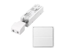 Lauritz Knudsen 35W/24V LED-driver og trådløst tryk til FUGA, vist samlet på hvid baggrund.