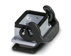 Detalje af Phoenix Contact indbygningshus HC STA B06, viser den sorte låsemekanisme og brandlogo tydeligt.