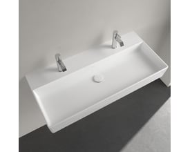 Villeroy & Boch Memento 2.0 håndvask, 100 cm, monteret på en hvid væg over et mørkegråt gulv, med to krom vandhaner og afløb.