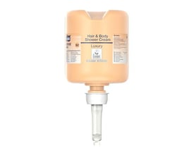 Tork Luksus Hair & Body Mini flydende sæbe i en ferskenfarvet beholder med dispenserpumpe.