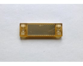 Schneider Electric laserfoto reflektor 40x16mm, Ecolab, med mikrosprismeteknologi og monteringshuller i hver ende.