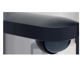 Niko Home Control udendørs bevægelsessensor i sort, med 180 graders detektering og 13 meter rækkevidde, vist på grå baggrund.