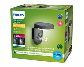 Emballagen til Philips Lighting Tyla solcelle væglampe med sensor, der viser produktet og dets funktioner.